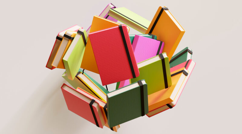 A imagem representa livros que foram escritos por pessoas trans.